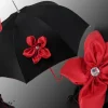 Creazione con fiore rosso e Swarovski